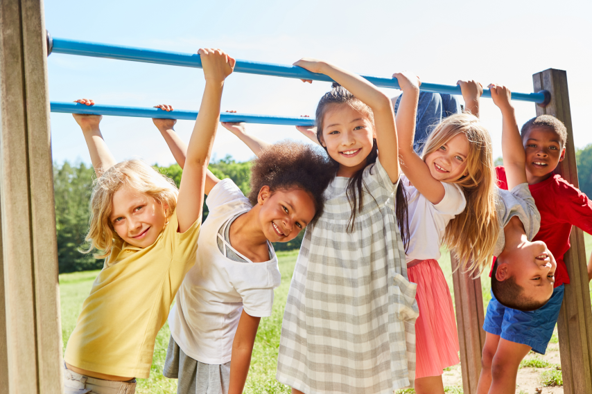 diverse kids playing on playground